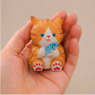 Cat Holding a Fish