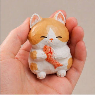 Cat Holding Fish Figurine