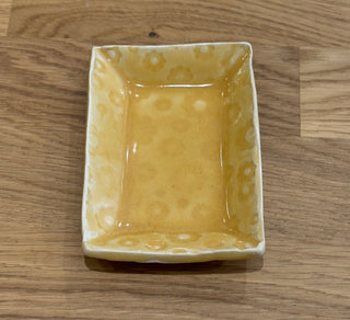 Rectangular ceramic dish on a wooden surface