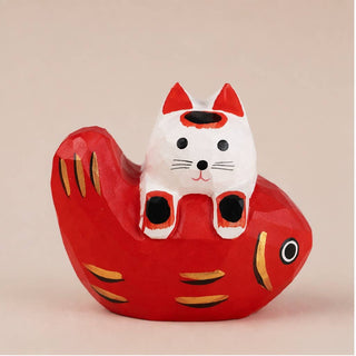 Cat Laying on Fish Figurine