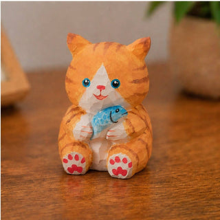 Cat Holding a Fish